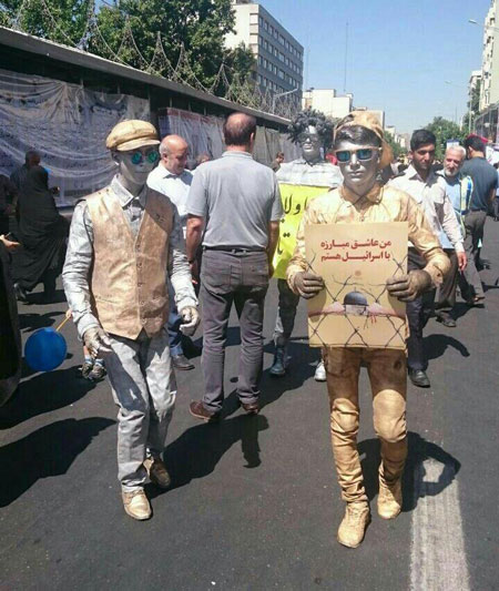 پوشش متفاوت دو شرکت کننده در روز قدس